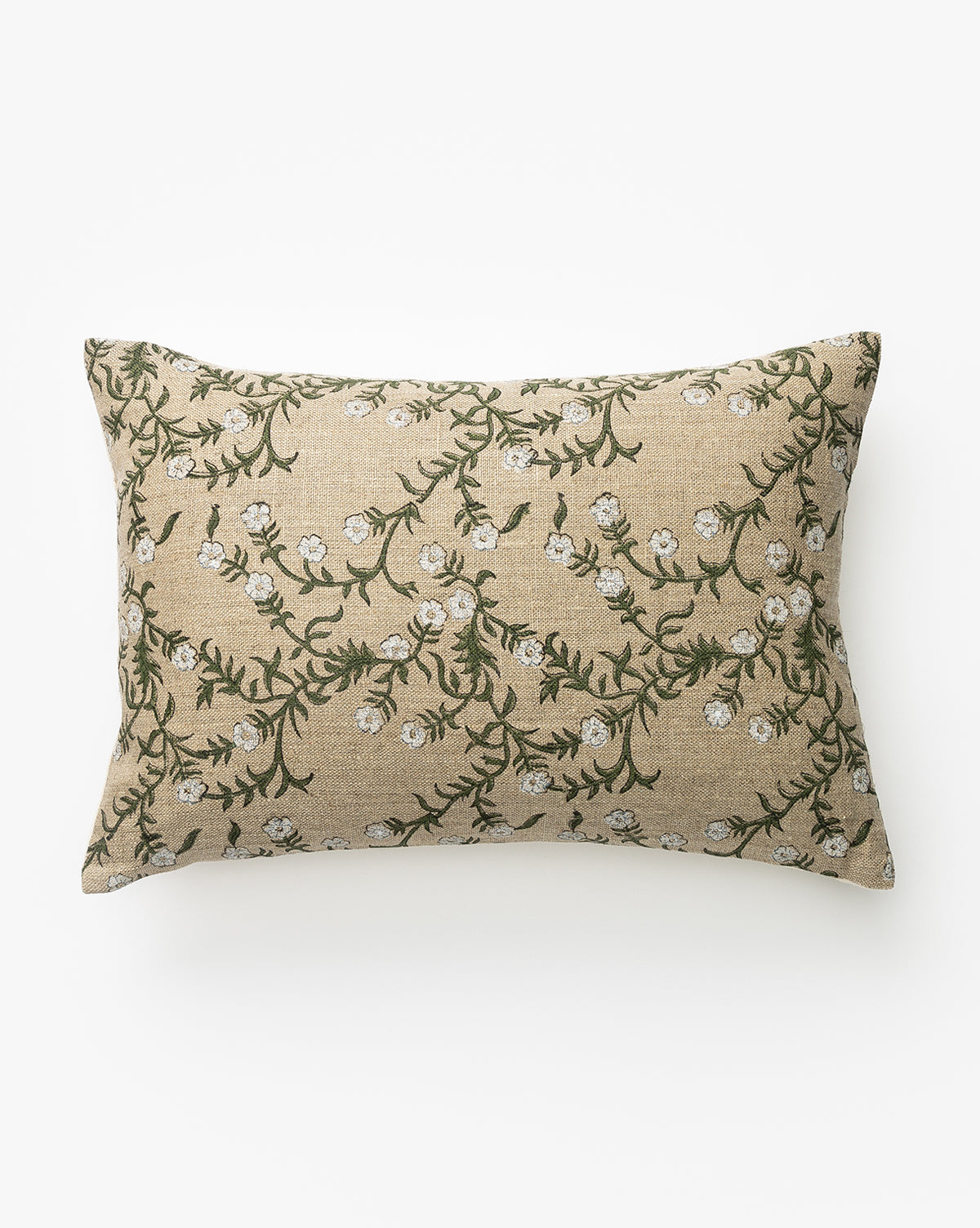 The Gia Pillow Cover features a rectangular design with a beige background and green vines with white flowers embroidered on linen, shown on a white surface by McGee & Co.