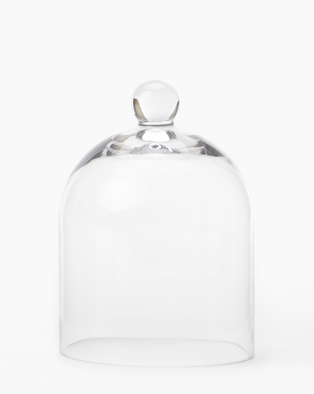 The Glass Cloche features a clear design with a round top knob, ideal for displaying baked goods or enhancing your kitchen décor. Shown against a plain white background.