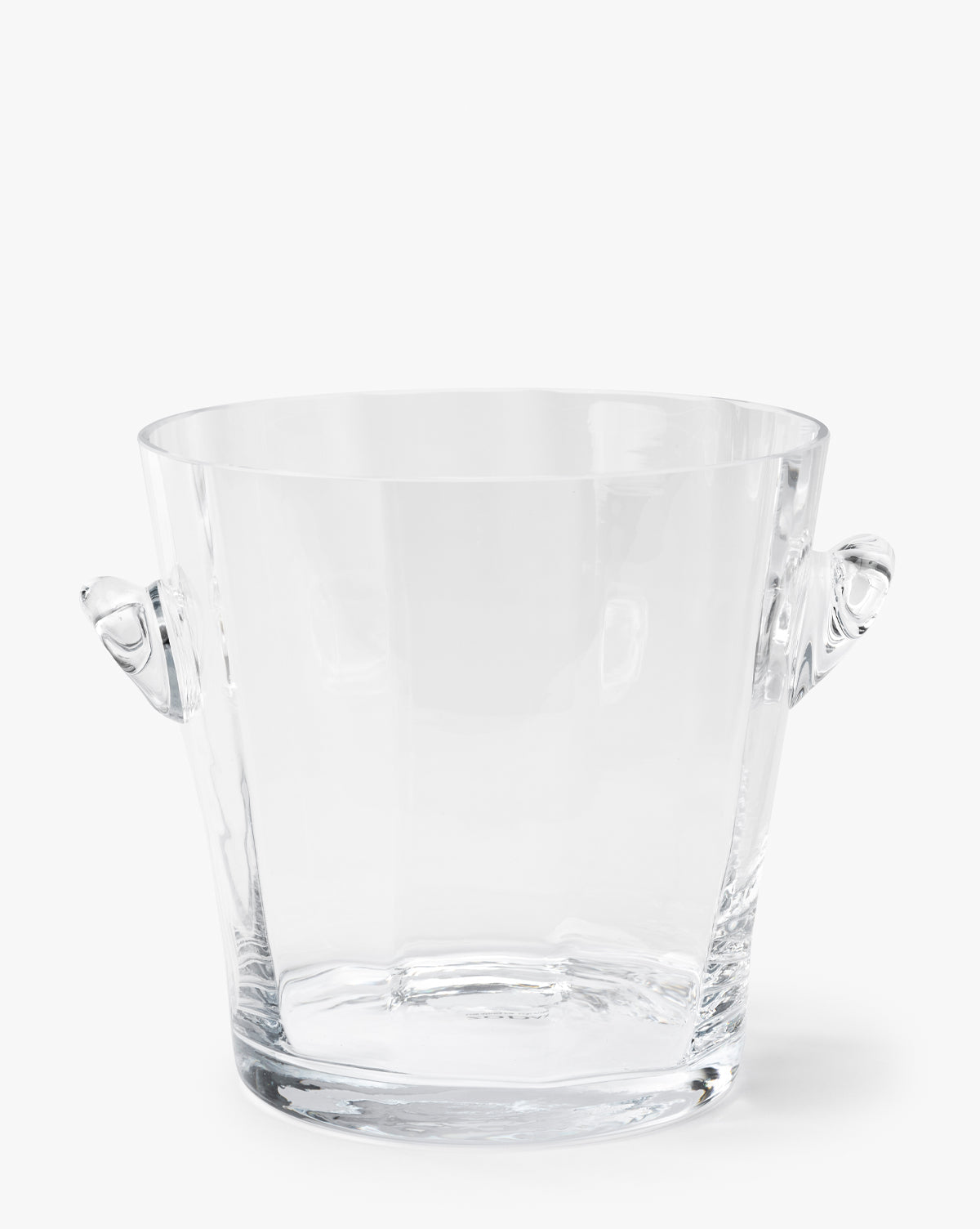 The Glass Ice Bucket features clear glass and two small round handles on opposite sides, adding a touch of elegance to your bar cart, by McGee & Co. Shown against a plain white background by McGee & Co.