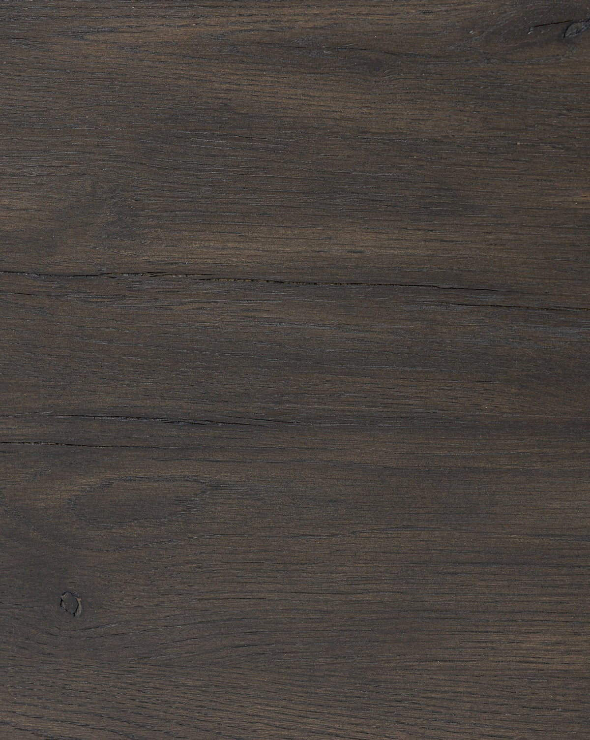 The Glenndon Oak Nightstand features a dark brown wooden surface with visible grain patterns, subtle knots, and horizontal lines, capturing the natural textured look of black-finished oak, by McGee & Co.