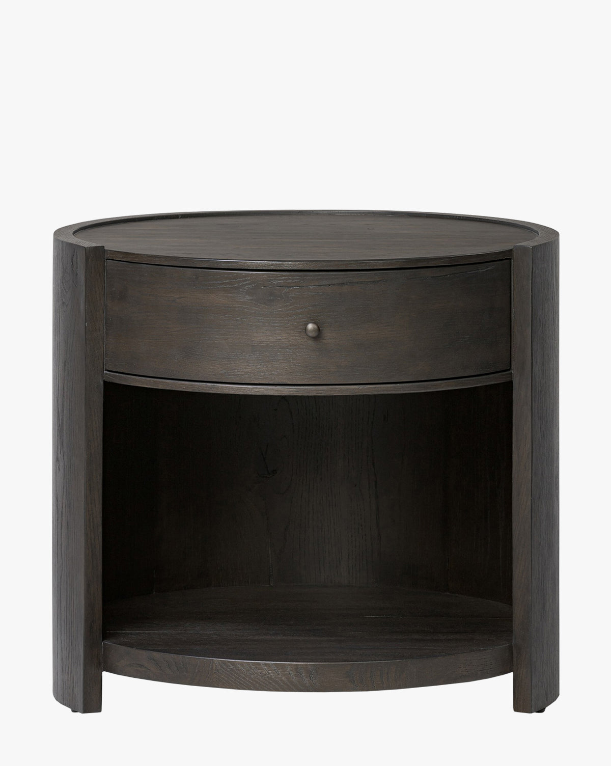 The Glenndon Oak Nightstand features a round black-finished design, one drawer with a small knob, and an open lower shelf—making it a stylish and functional bedside table, by McGee & Co.