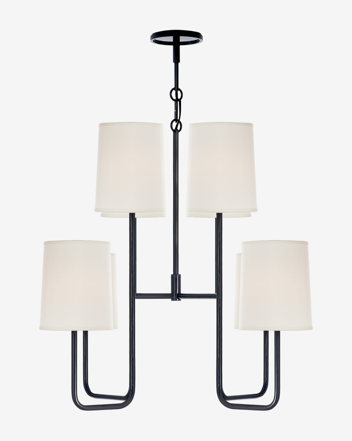 The Go Lightly Medium Chandelier by Visual Comfort & Co. Signature features a black metal frame with four white cylindrical shades, evenly spaced on a central rod—perfect as a minimalist lighting solution and striking accent for any space. Available at McGee & Co.