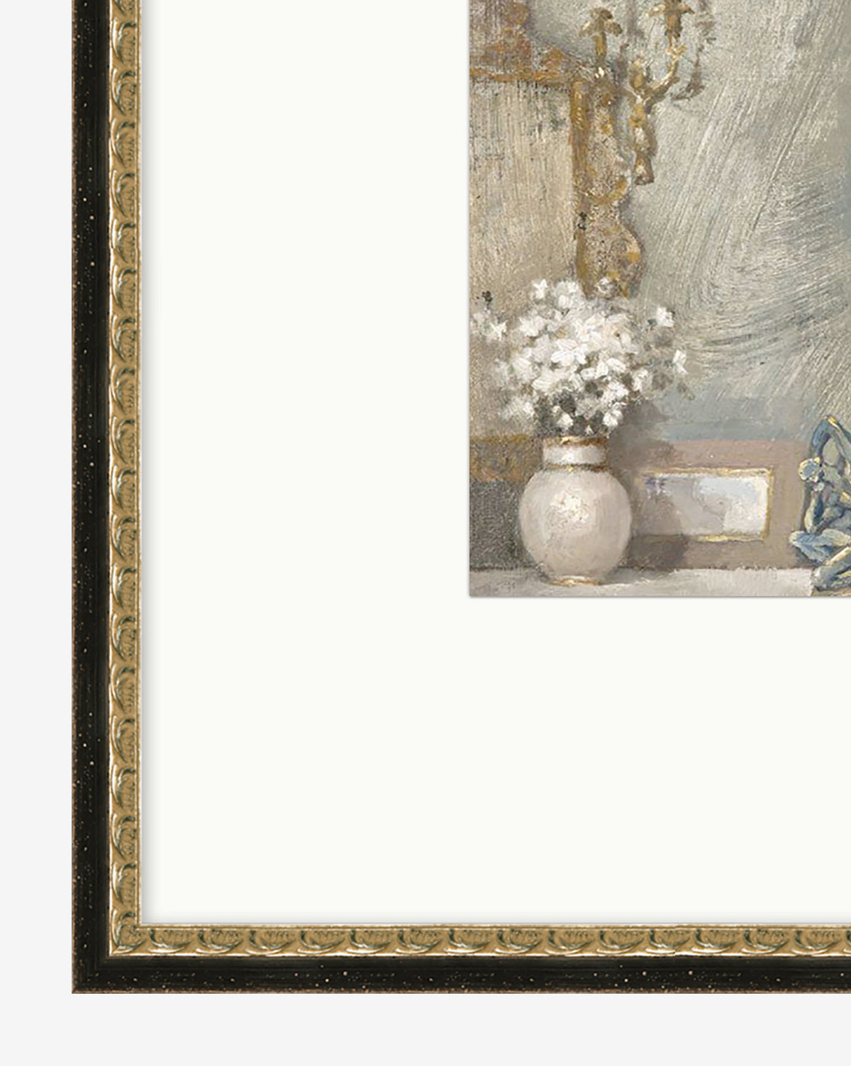 A close-up of Golden Still Life wall art: a framed painting or giclee print features a white vase with white flowers on a table, a small blue figurine, and is bordered by an ornate gold frame.