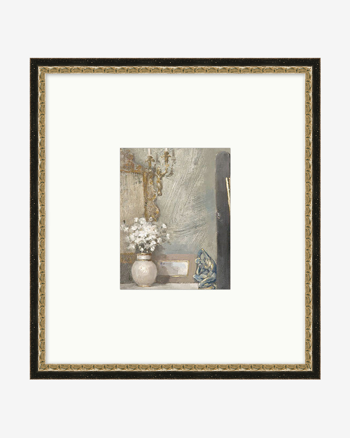 Golden Still Life is a framed vintage wall art featuring a small still life painting of a white vase with flowers, gold sconce, textured gray wall, and blue figurine, all set in a wide white mat and ornate black frame.