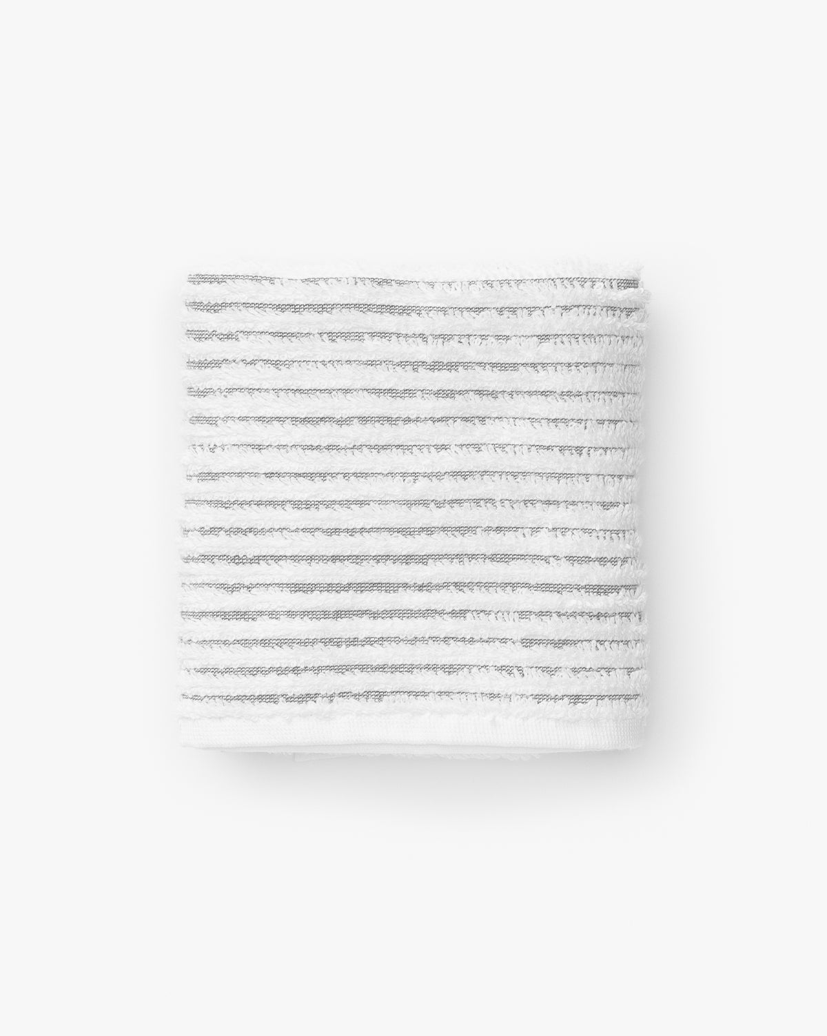 A white towel with thin gray stripes from the Gray Striped Bath Collection, crafted from Aegean cotton, folded neatly on a plain white background.