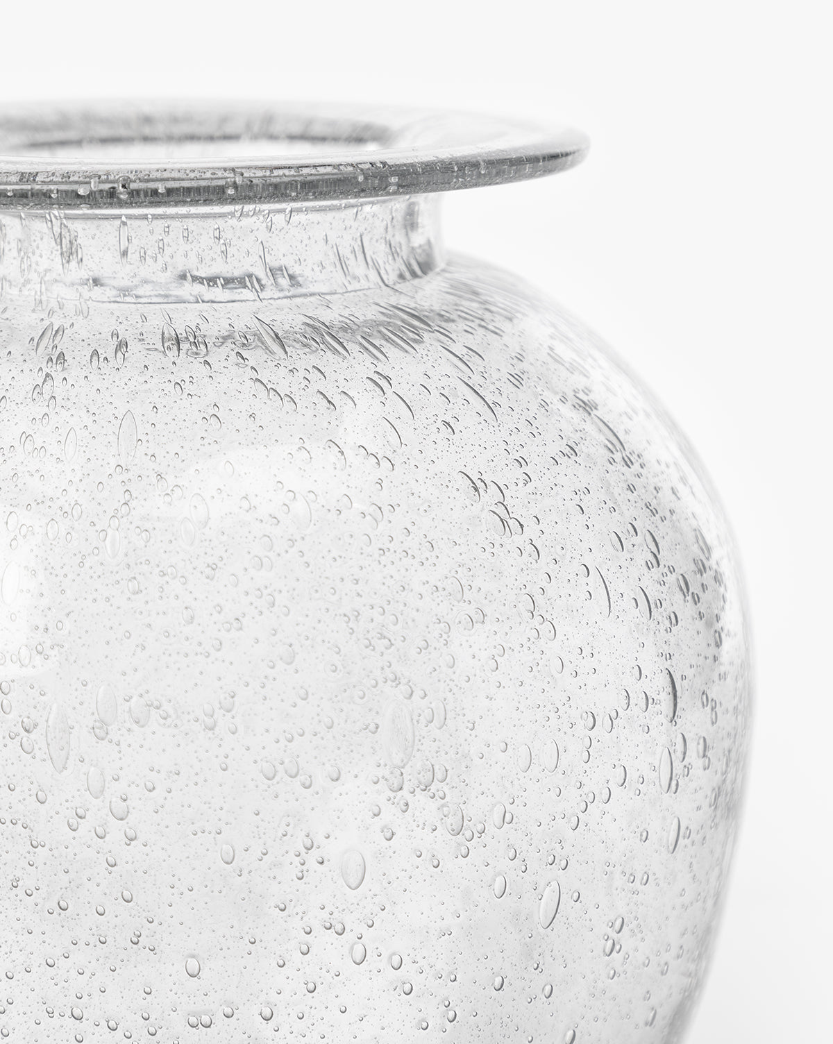 Close-up of the Gretchen Vase, showcasing its wide rim, rounded body, and numerous small air bubbles in the seeded glass, set against a plain white background, by McGee & Co.
