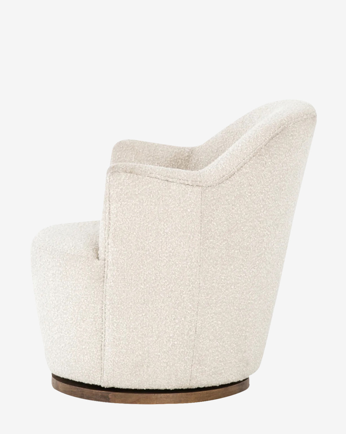 Side view of the Gulliver Swivel Chair, showcasing its rounded silhouette and boucle upholstery on a circular wooden base, set against a plain white background.