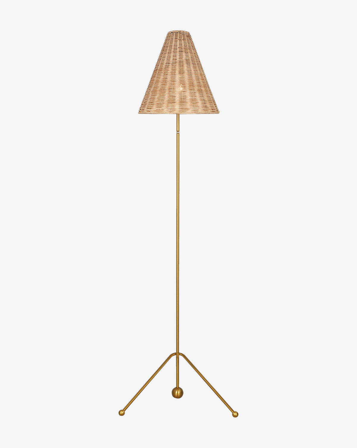 The Gustav Floor Lamp features a slender gold tripod stand with round feet and a cone-shaped woven wicker shade, shown against a plain white background by McGee & Co.