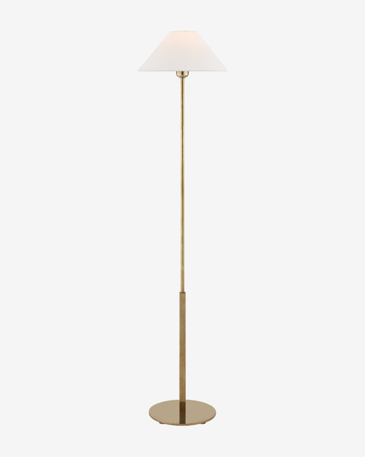 The Hackney Floor Lamp showcases a slim gold stand, a broad round base, and a white linen shade, offering a blend of elegance and simplicity on a plain white background, by McGee & Co.