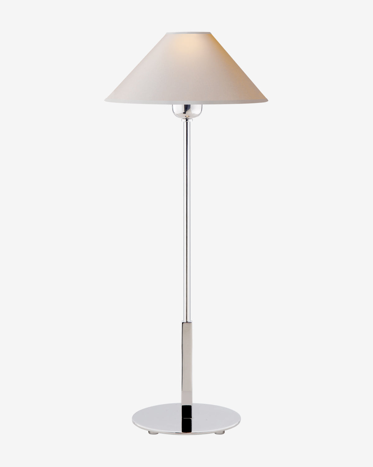 The Hackney Table Lamp features a modern brass body with a wide white linen shade, standing upright on a round metal base against a plain background, by McGee & Co.