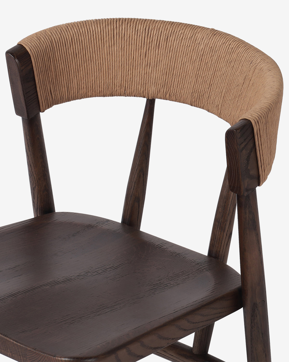 The Hallow Chair is a modern rustic dining chair with a dark brown seat and legs, plus a curved backrest wrapped in natural woven cord for added charm, by McGee & Co.