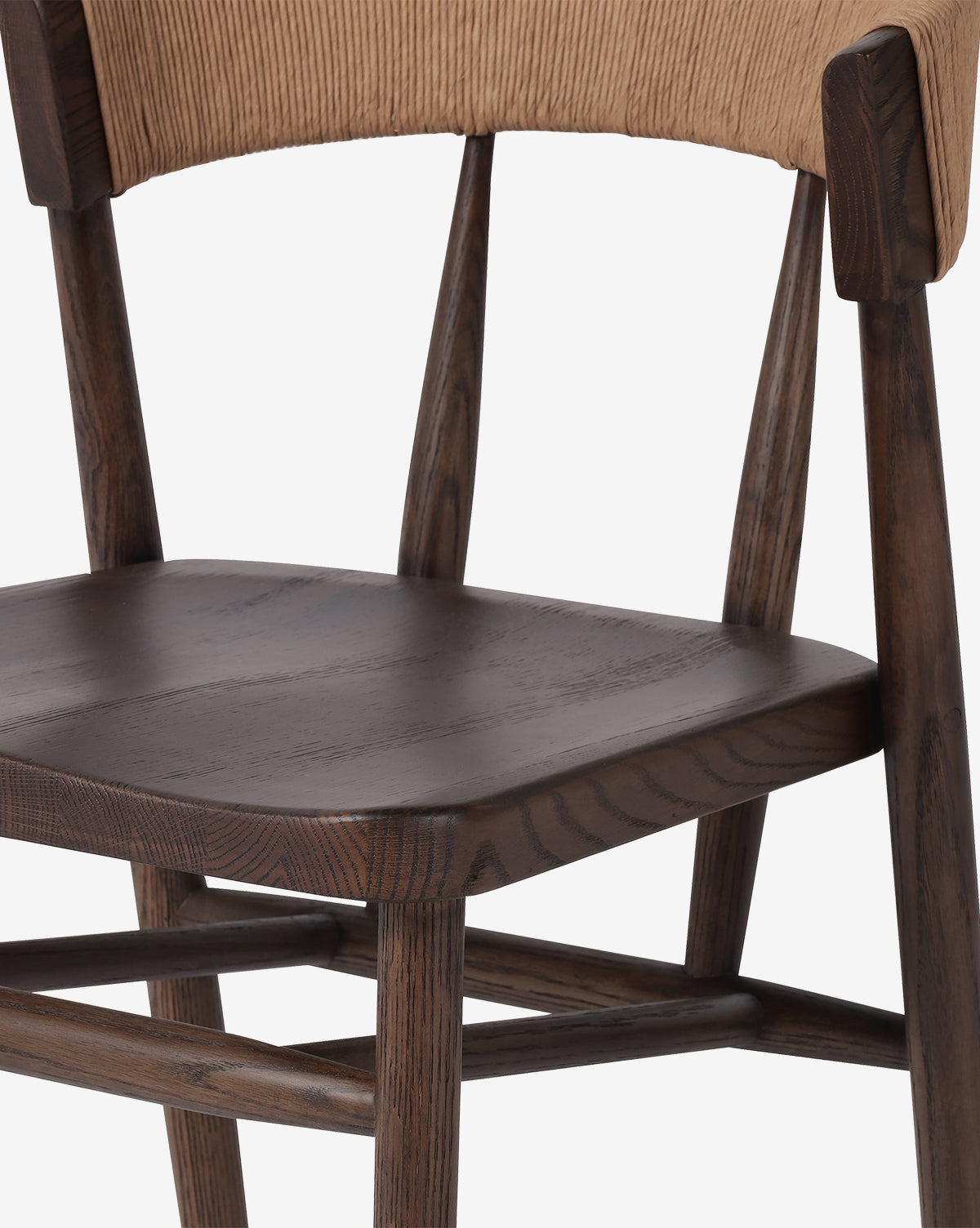 A close-up of the Hallow Chair shows its rustic design with dark brown seat and legs and a light tan corduroy upholstered backrest, set against a plain white background by McGee & Co.
