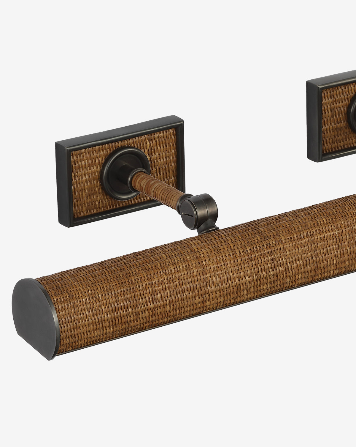 Close-up of the Halwell Picture Light, a wall-mounted rod featuring a textured woven rattan design and dark metal accents on rectangular mounts, ideal as stylish artwork lighting against a plain white background, by McGee & Co.