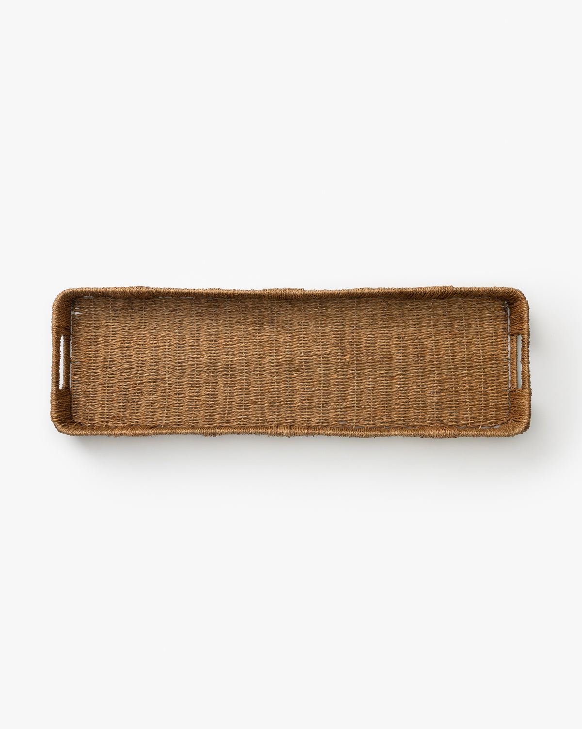 The Hand-Woven Bankuan Tray features a rectangular shape, raised edges, and handles at each end. Its natural woven texture adds a decorative touch and is displayed against a plain white background.