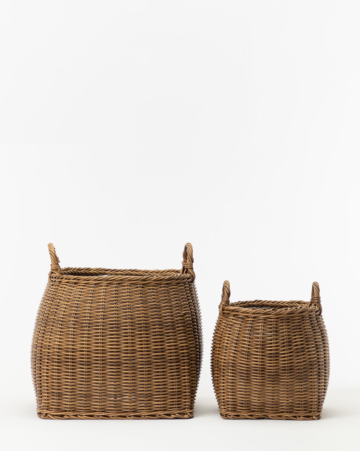Two Handled Planter Baskets in brown poly-rattan, one large and one small, are displayed side by side on a white background—ideal for showcasing indoor plants with style.