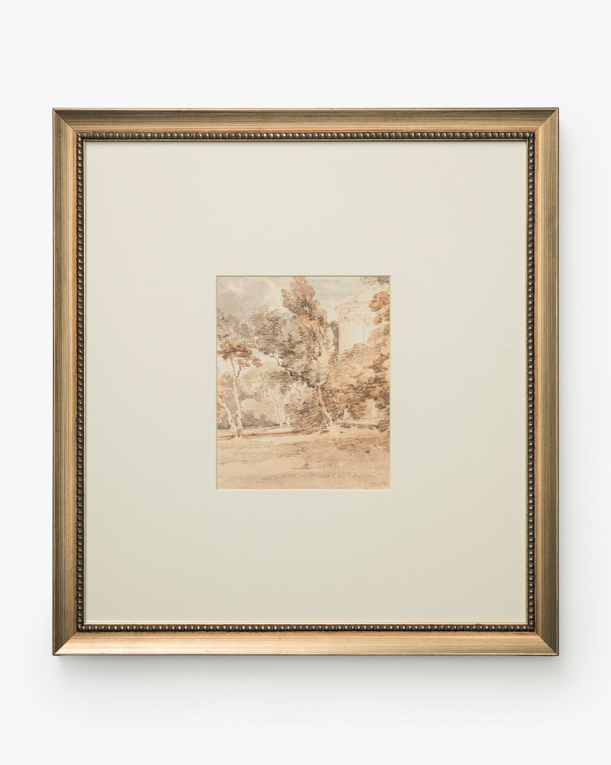 Harewood Park is a framed artwork with a gold beaded edge and wide white mat, showcasing a small, soft watercolor landscape of trees and distant buildings in muted earth tones, by McGee & Co.