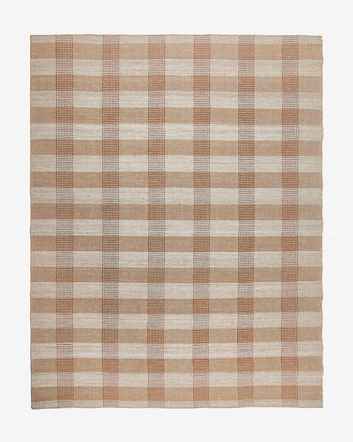 The Hargrove Handwoven Indoor/Outdoor Rug features a beige and light brown plaid checker pattern with evenly spaced stripes, shown on a white background.