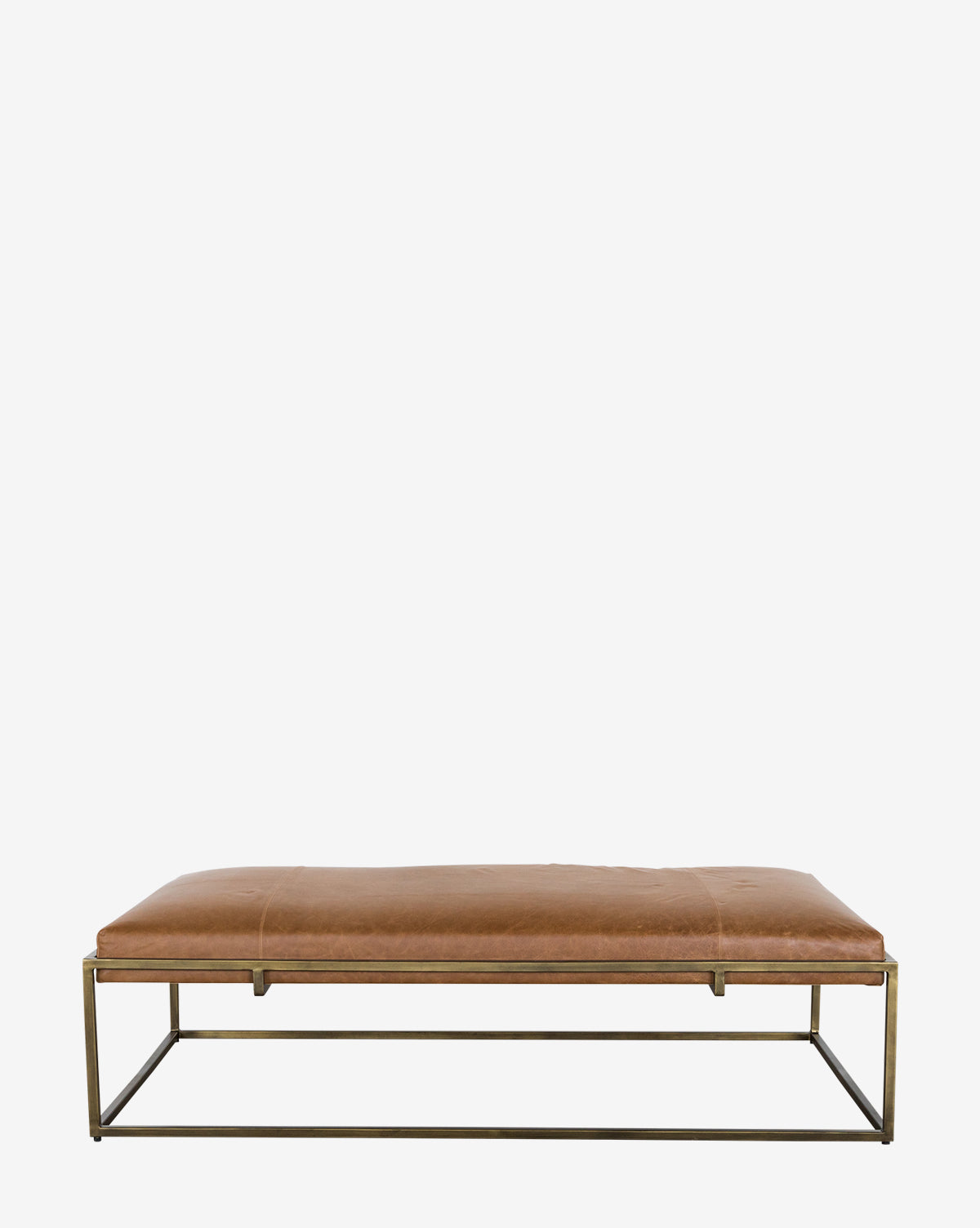 The Harlow Leather Coffee Table showcases a brown leather cushion top and an open brass-finished iron frame base, displayed against a plain white background by McGee & Co.