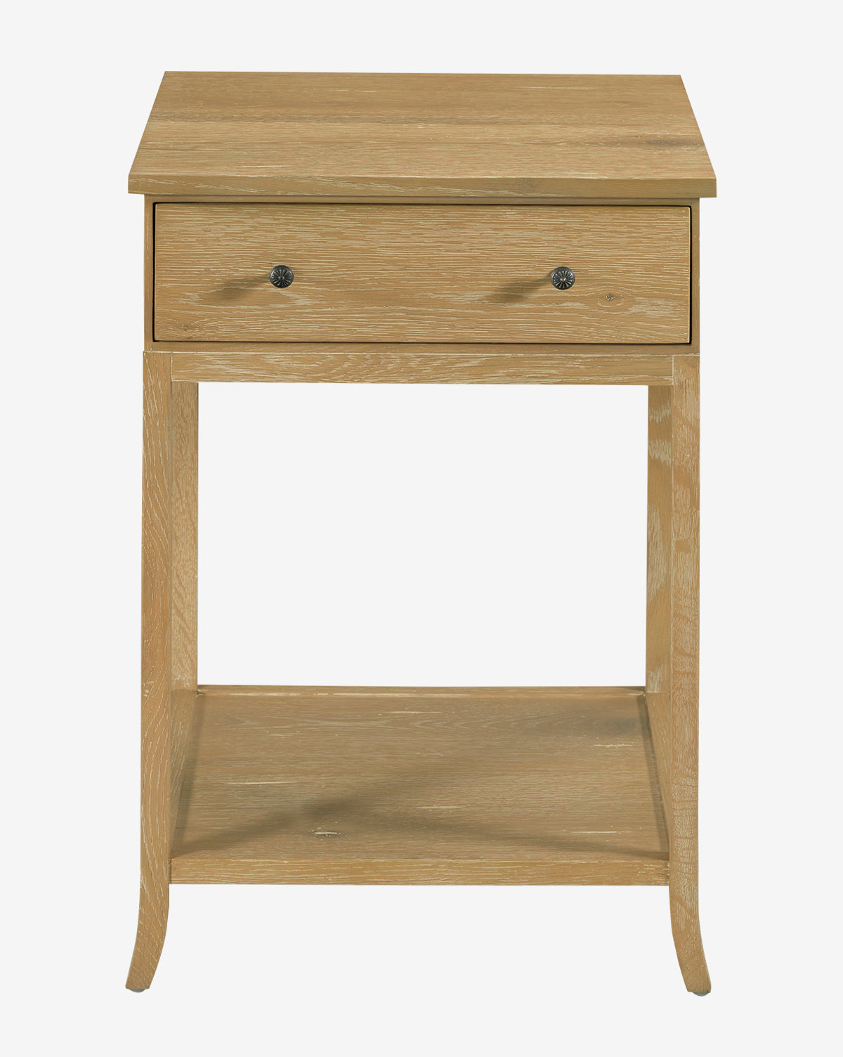 The Harrisburg Side Table is crafted from light wood with a natural oak finish. It features a single drawer with two round knobs, an open lower shelf, straight legs, and a simple modern design by McGee & Co.