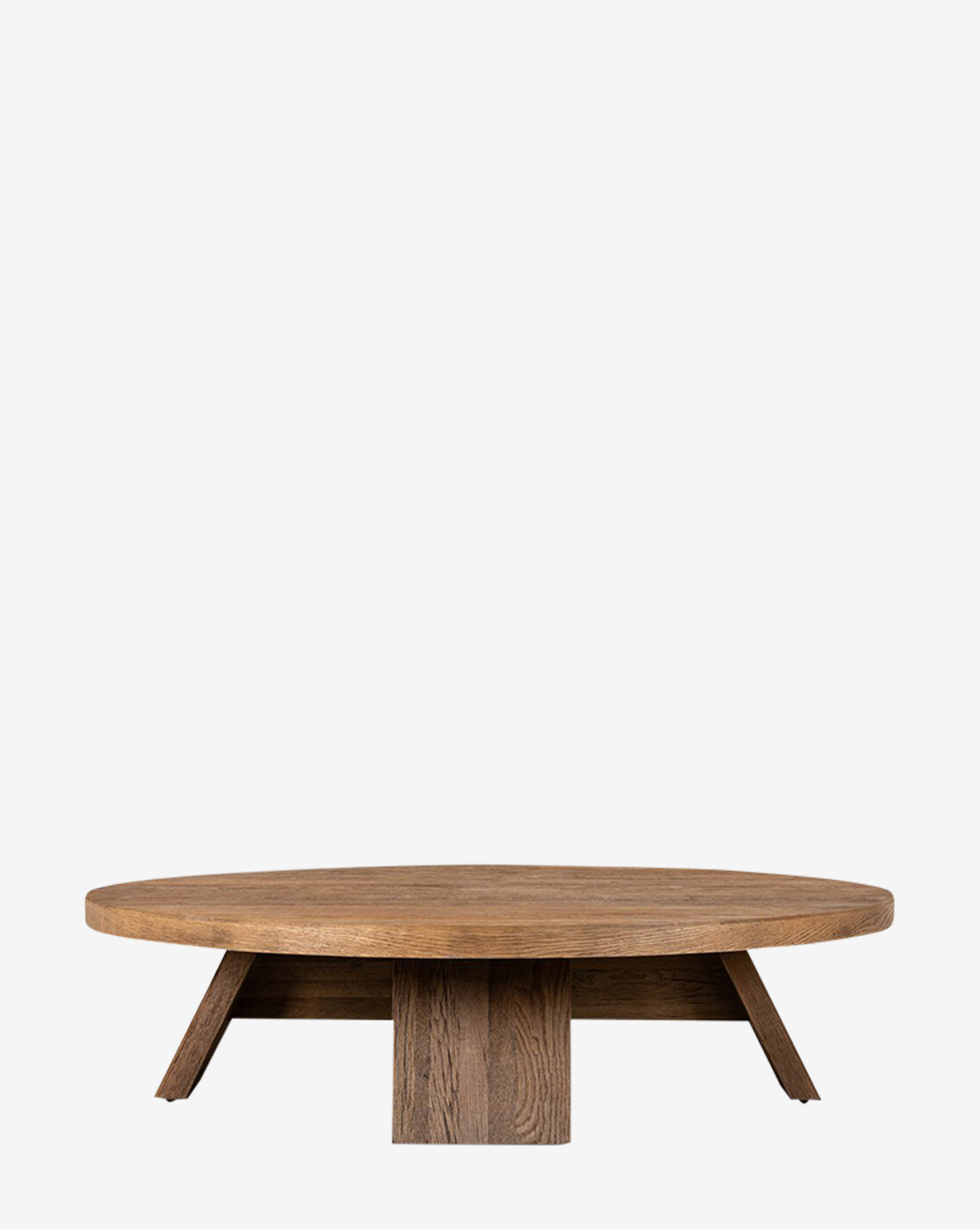 The Harvey Coffee Table features a low, round design with a thick tabletop and four angled legs, expertly crafted from resawn oak, by McGee & Co.
