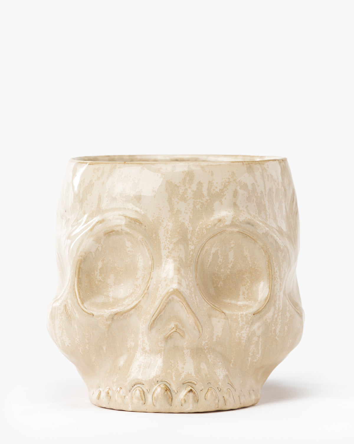The Haunting Skull Vase is a beige ceramic vase shaped like a human skull with detailed features—an ideal statement piece or spooky addition to your Halloween décor, by McGee & Co. Displayed on a plain white background.