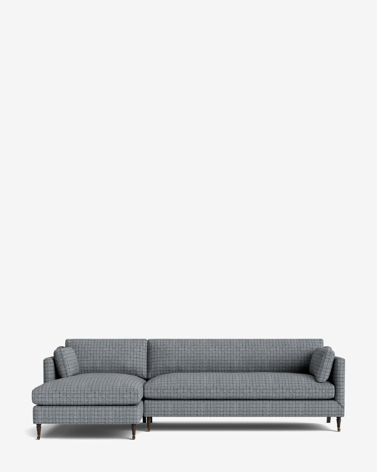 The Haverford Upholstered Left Chaise Sectional 113 features a modern design with a left-facing chaise, slim metal legs, and two cylindrical accent pillows, shown against a plain white background by McGee & Co.