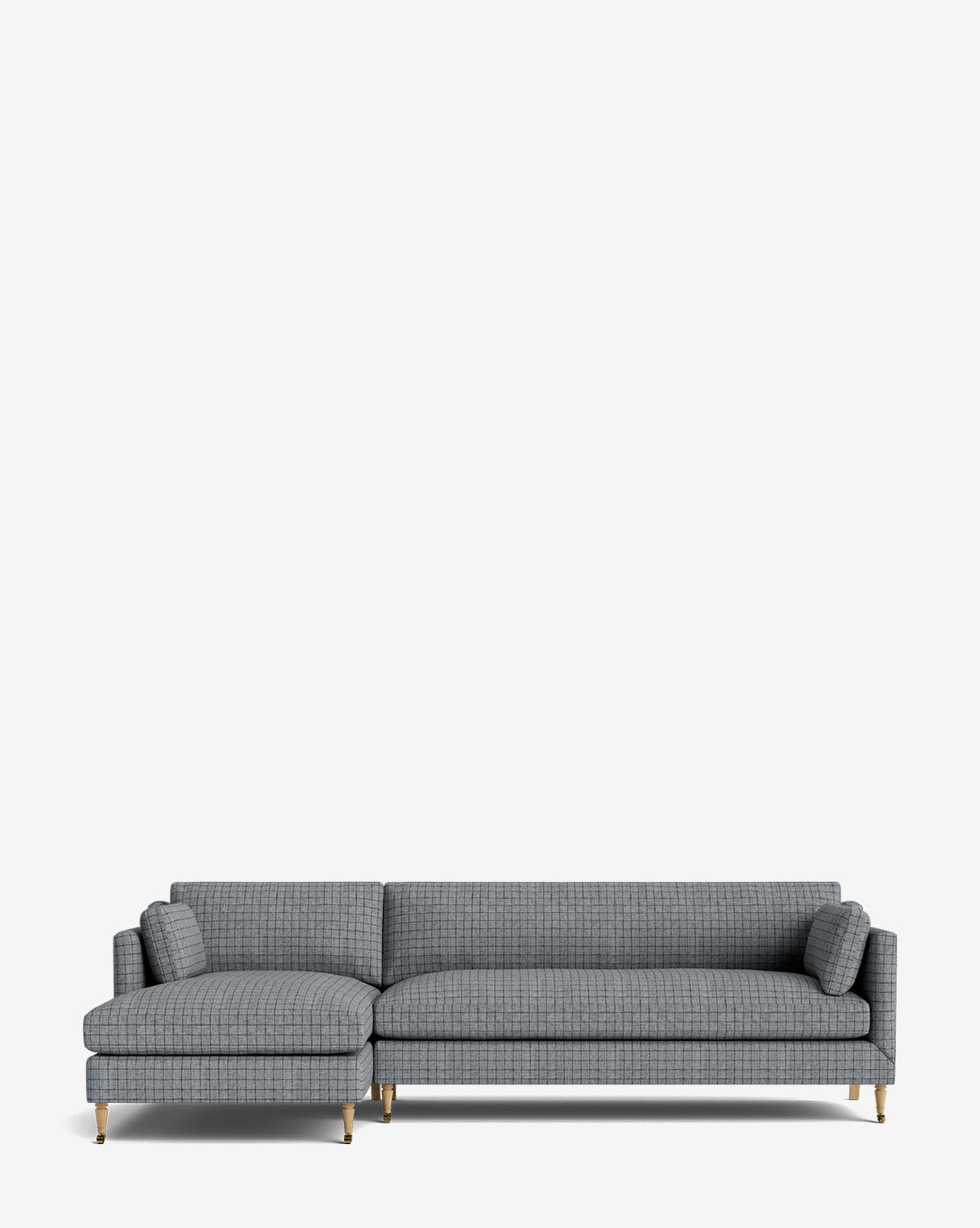 The Haverford Upholstered Left Chaise Sectional 113 features modern gray upholstery, a left-side lounge, thin gold legs, and two matching cylindrical pillows, shown against a plain white background by McGee & Co.