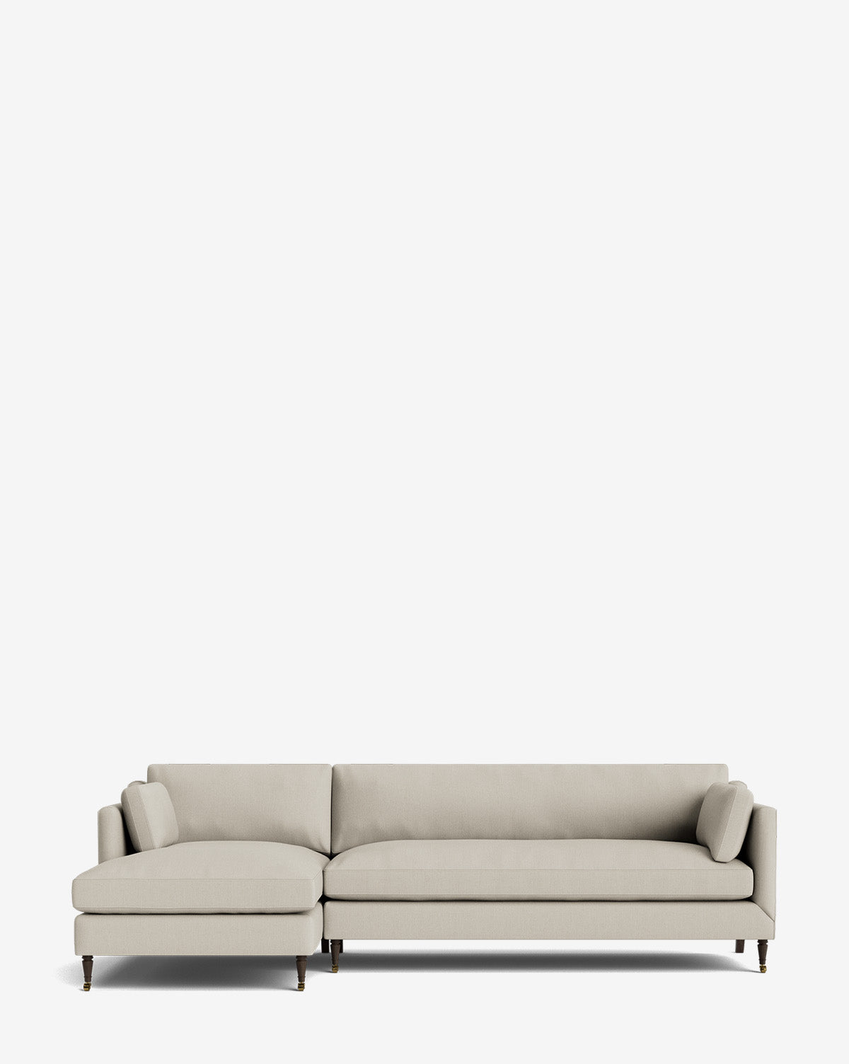 The Haverford Upholstered Left Chaise Sectional 113 is a modern, customizable light gray sofa with slim arms and dark wooden legs, featuring an upholstered chaise on the left side, shown against a plain white background by McGee & Co.