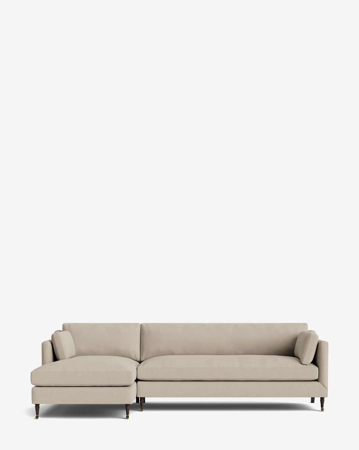 The Haverford Upholstered Left Chaise Sectional 113 is a modern beige sectional with a left-facing chaise, low backrest, two bolster cushions, and slim wooden legs, shown against a plain white background by McGee & Co.
