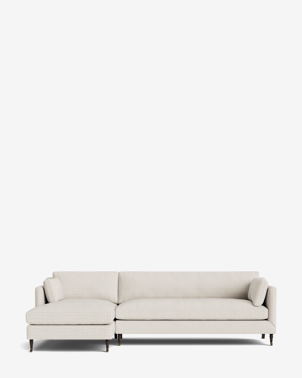 The Haverford Upholstered Left Chaise Sectional features a modern, light beige design with slim cushion armrests and two matching bolster pillows, shown on a plain white background, by McGee & Co.