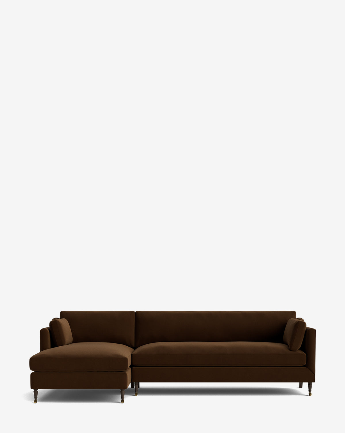 The Haverford Upholstered Left Chaise Sectional 113 is a modern, dark brown L-shaped sofa with slim metal legs and two bolster pillows, shown against a plain white background, by McGee & Co.