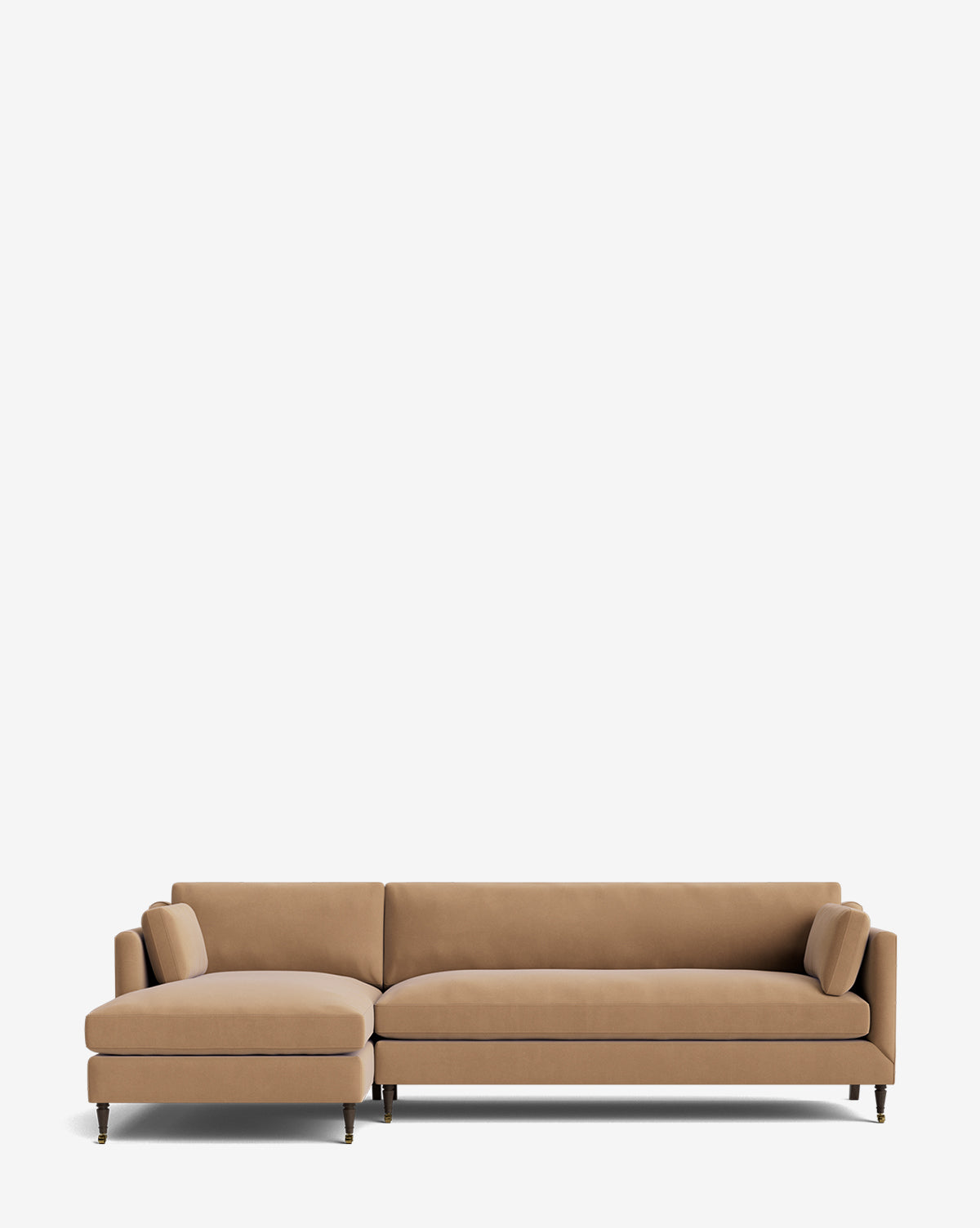 The Haverford Upholstered Left Chaise Sectional features a customizable tan design with slim cushions, matching bolster pillows, and thin black legs, displayed against a plain white background by McGee & Co.