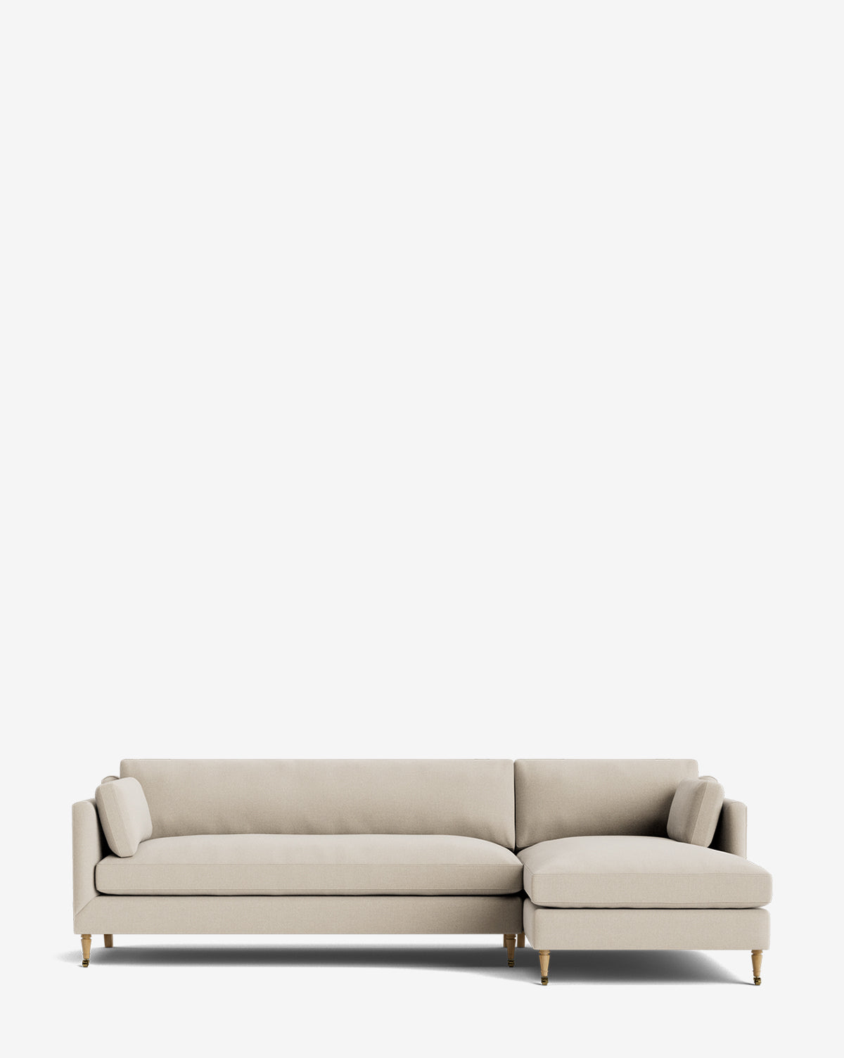 The Haverford Upholstered Right Chaise Sectional by Rowe Fine Furniture features a modern light beige design, angled legs, two matching bolster pillows, and a right chaise extension, set against a plain white background. McGee & Co.
