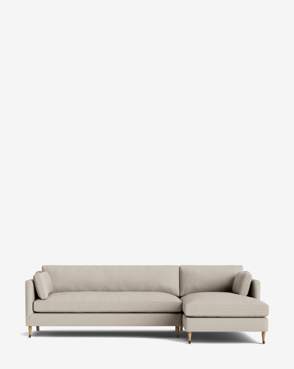 The Haverford Upholstered Right Chaise Sectional 113 in light beige features slender wooden legs and a right-side chaise lounge, set against a plain white background—a customizable centerpiece for your space, by McGee & Co.