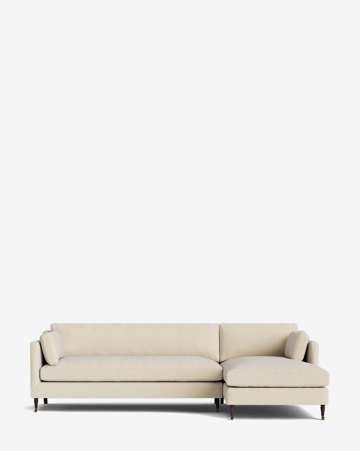 The Haverford Upholstered Right Chaise Sectional by Rowe Fine Furniture is a modern beige sectional with wooden legs and two cylindrical pillows, shown against a plain white background, McGee & Co.