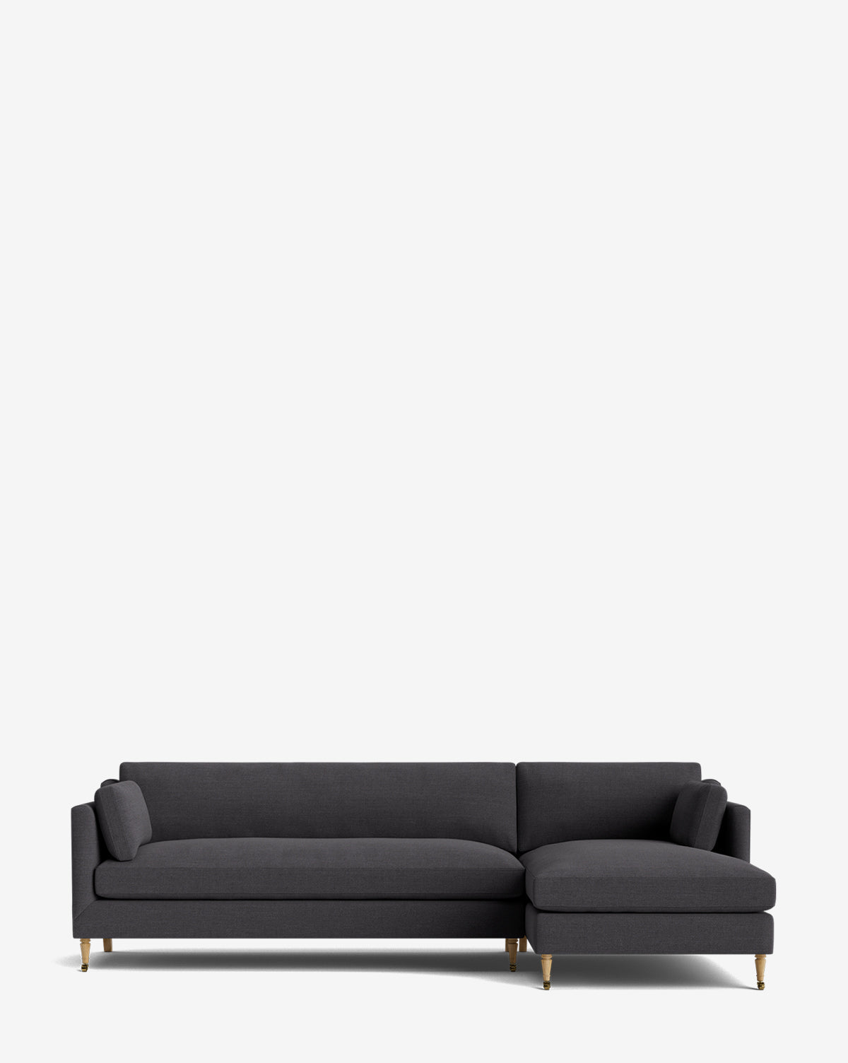 A modern dark gray Haverford Upholstered Right Chaise Sectional by Rowe Fine Furniture, featuring slim armrests, two cylindrical cushions, and wooden legs with gold-tone accents, sits against a plain light background for a stylish, customizable look by McGee & Co.