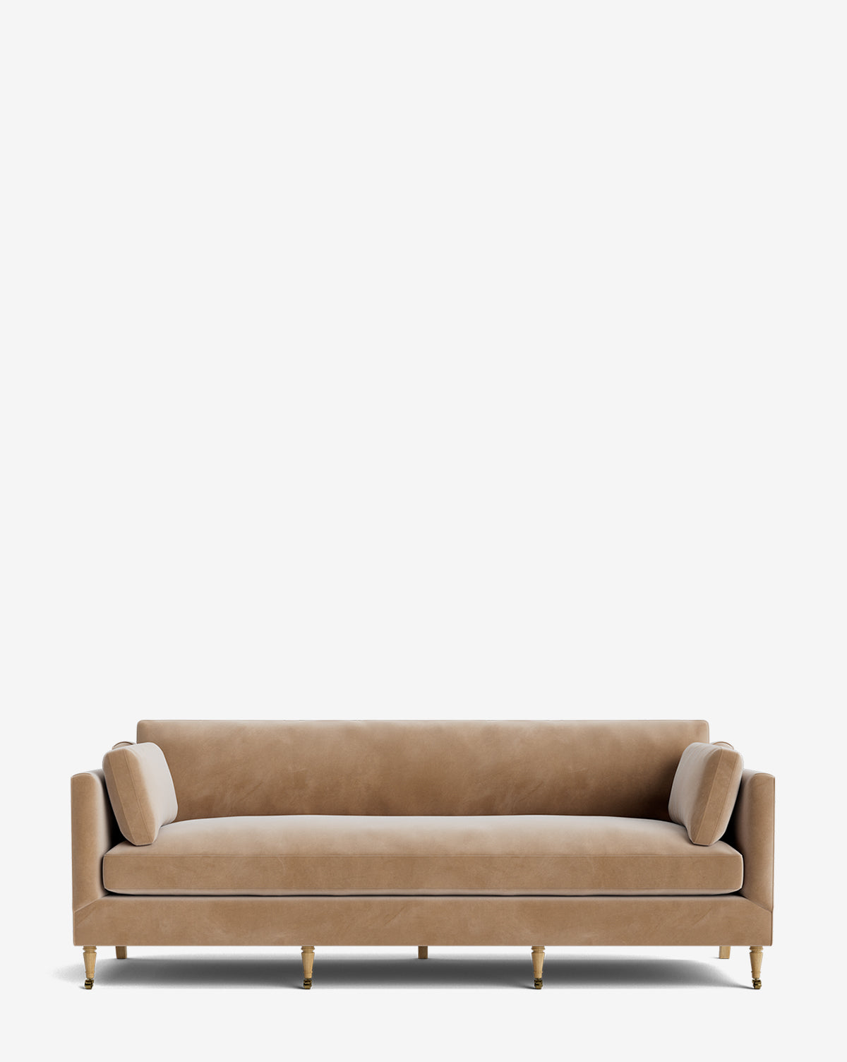 The Haverford Upholstered Sofa 90 features modern beige velvet, a low back, straight arms, two cylindrical side cushions, and four gold-colored legs, shown against a plain white background by McGee & Co.