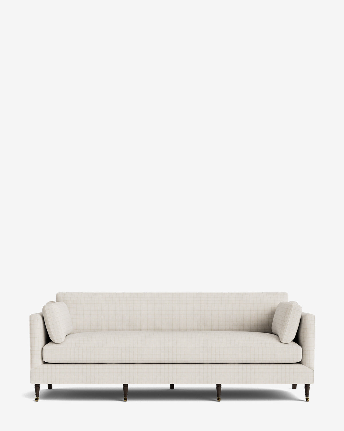 The Haverford Upholstered Sofa 90 is a modern, handcrafted light beige sofa featuring a simple rectangular design, slim arms, dark wooden legs with caster wheels, and two matching cylindrical cushions against a white background by McGee & Co.