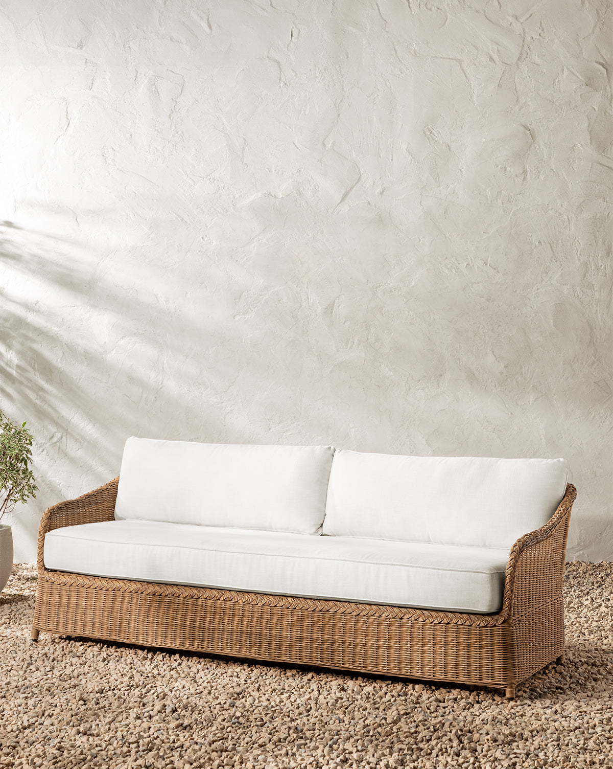 McGee & Co. woven wicker outdoor sofa.