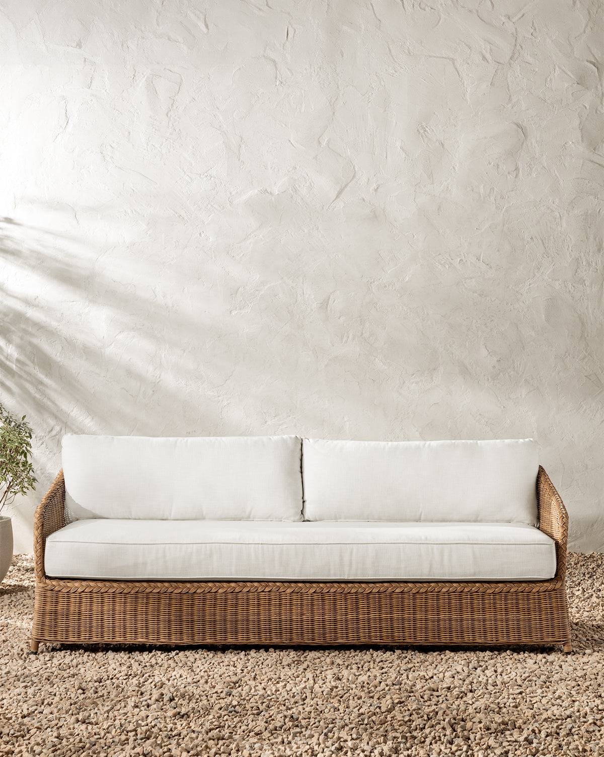 McGee & Co. woven wicker outdoor sofa.