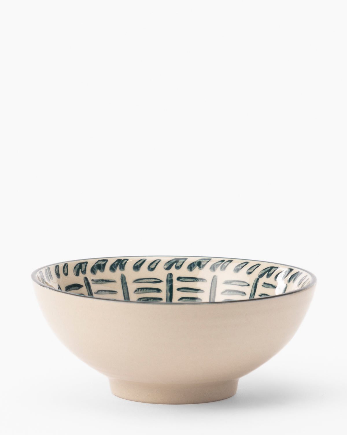 The Mattia Hand-Painted Bowl features a beige glazed stoneware body, a subtle footed base, and blue-green floral designs individually painted around the inner rim, all set against a plain white background, by McGee & Co.