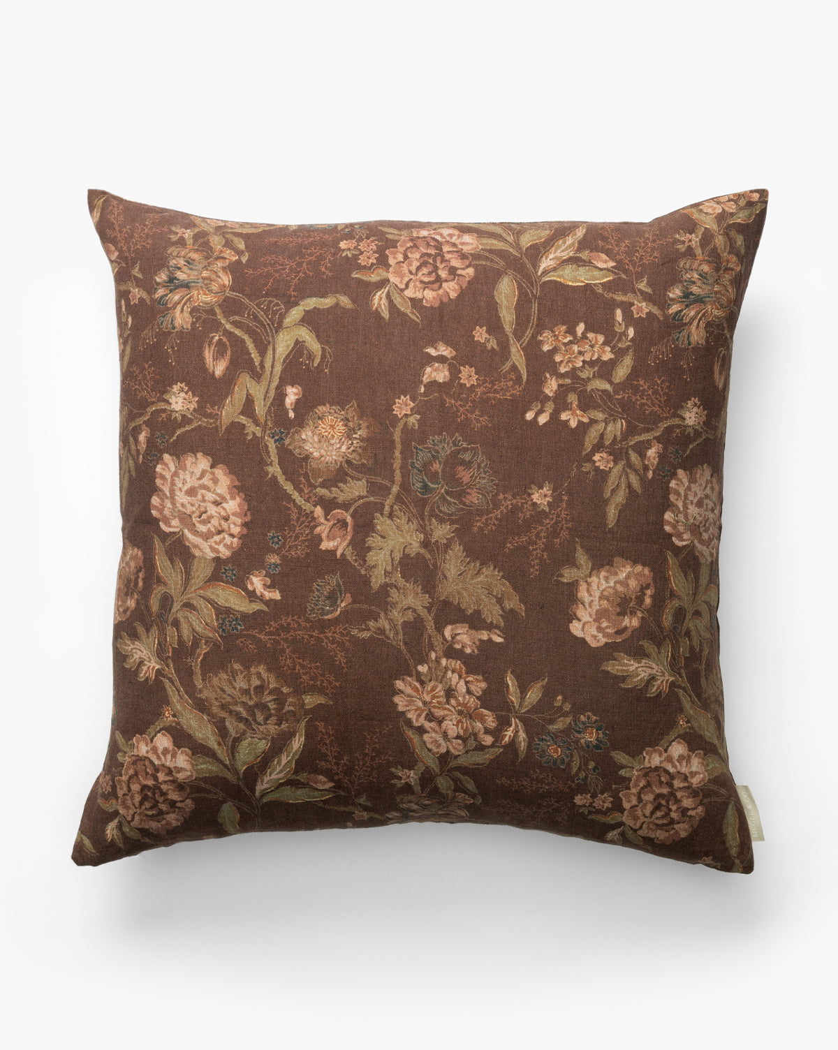 The Hestercombe Pillow Cover is a vintage-inspired square pillow cover with a brown background and floral patterns in muted pink, green, and beige, shown against a plain white backdrop by McGee & Co.