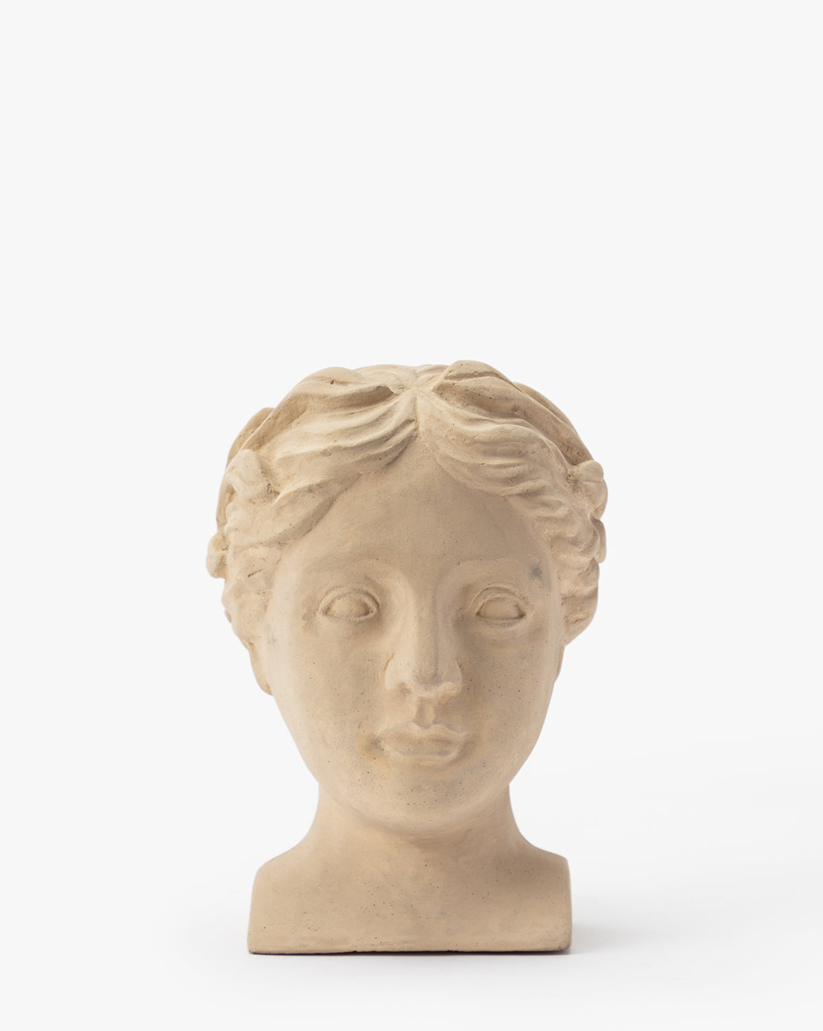 The Hestia Bust is a beige, classical-style sculpture of a womans head and neck with wavy hair and a calm expression, crafted from composite stone—perfect for adding artistic decor to any space.