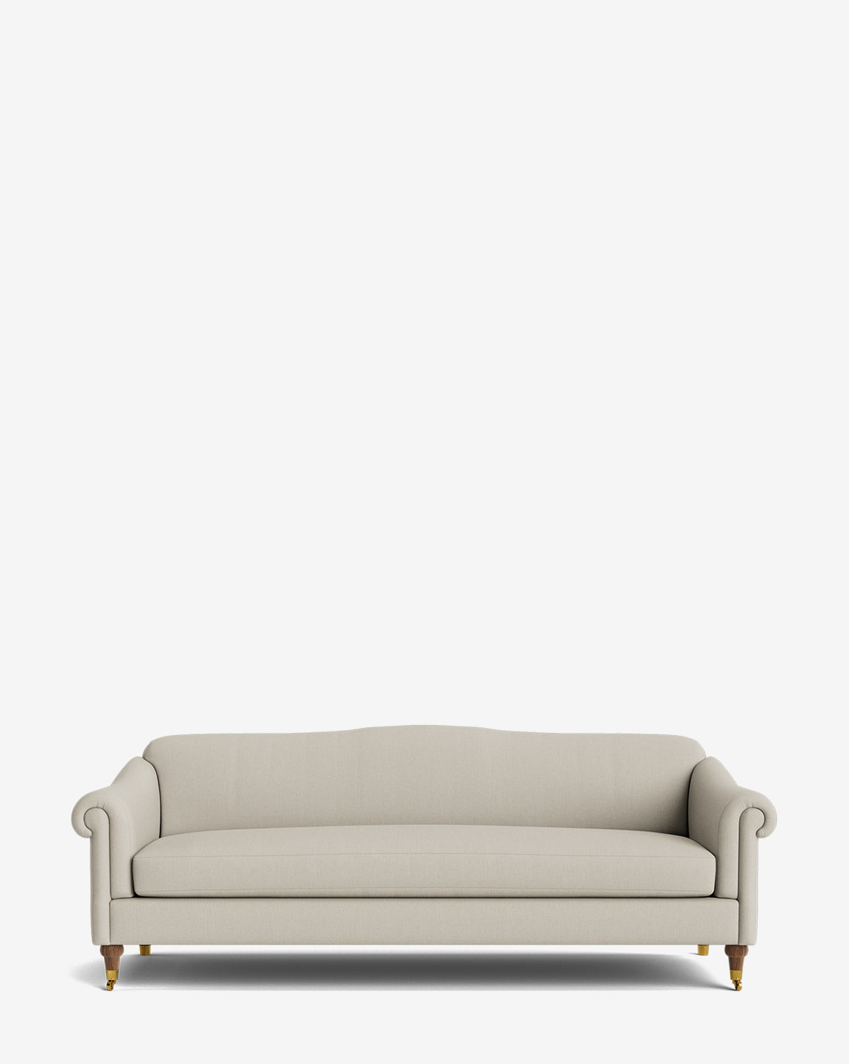 The Hildegard Sofa 90 is a beige upholstered, handcrafted sofa featuring rolled arms, a cushioned back, and wooden legs with brass tips, shown against a plain white background by McGee & Co.