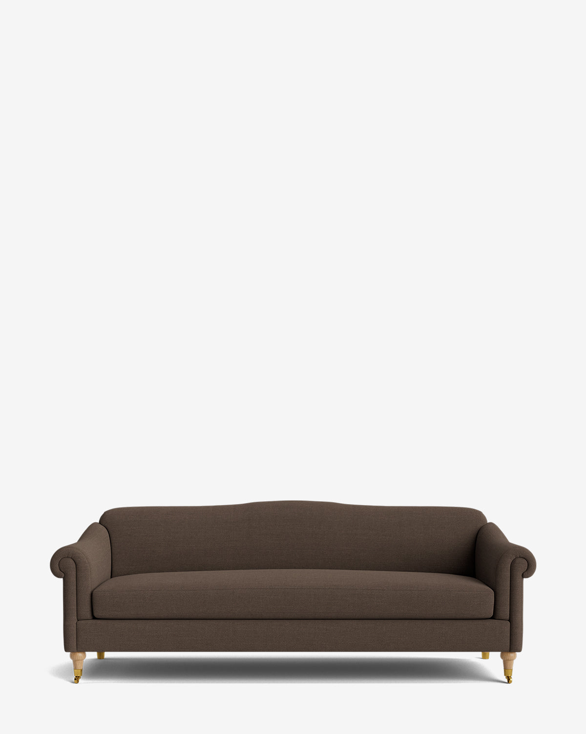 The Hildegard Sofa 90 is a brown, upholstered, handcrafted sofa featuring rolled arms, a straight back, and wooden legs with brass casters, shown against a plain white background by McGee & Co.