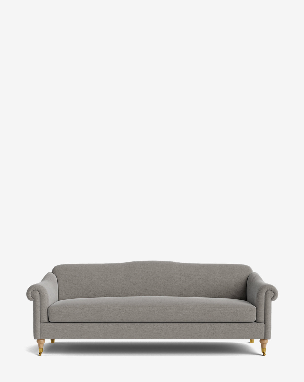 The Hildegard Sofa 90 is a gray upholstered, handcrafted sofa featuring rolled arms, a curved backrest, and wooden legs with brass casters, shown against a plain white background by McGee & Co.
