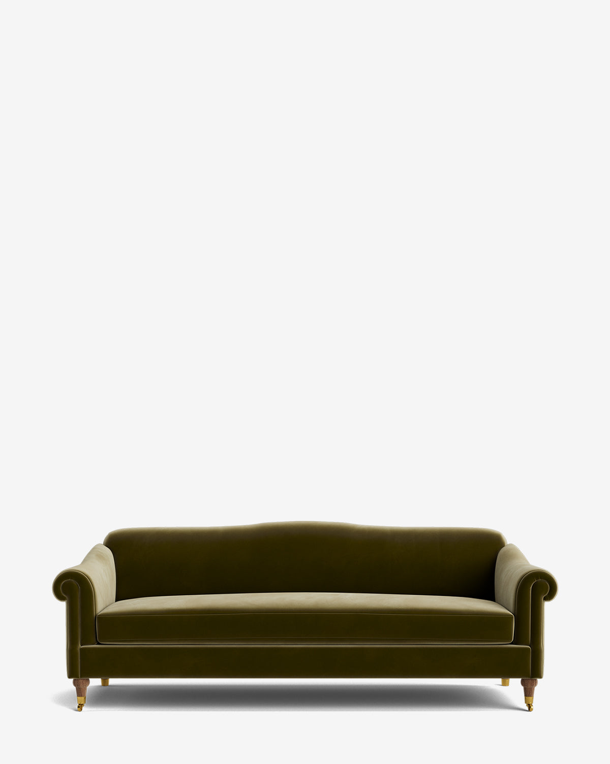 The Hildegard Sofa 90 features green velvet upholstery, rolled arms, a curved backrest, and wooden legs with brass casters, shown against a plain white background, by McGee & Co.