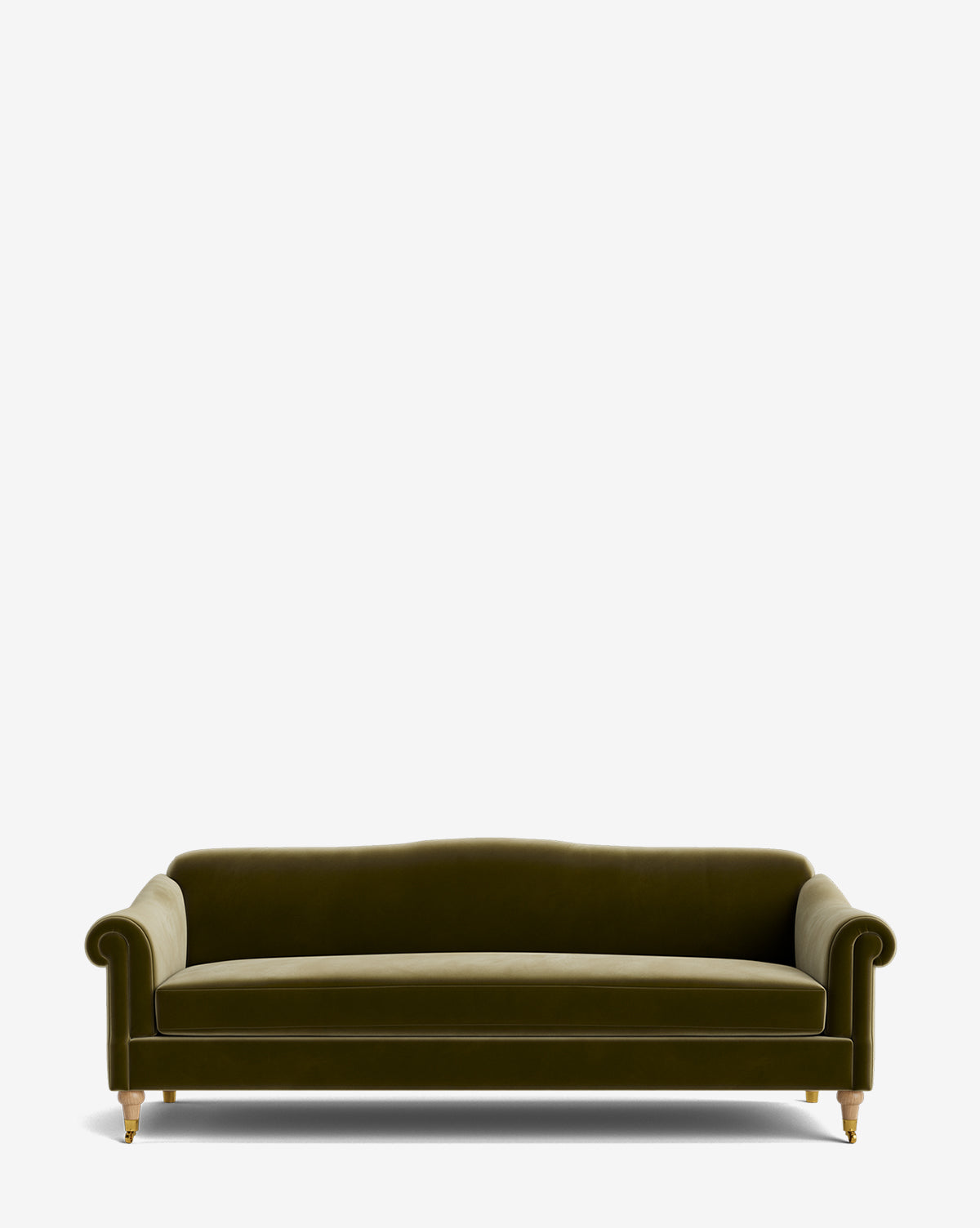 The Hildegard Sofa 90 is a green velvet, handcrafted piece with rolled arms, a curved back, and gold-capped wooden legs, shown against a plain white background by McGee & Co.