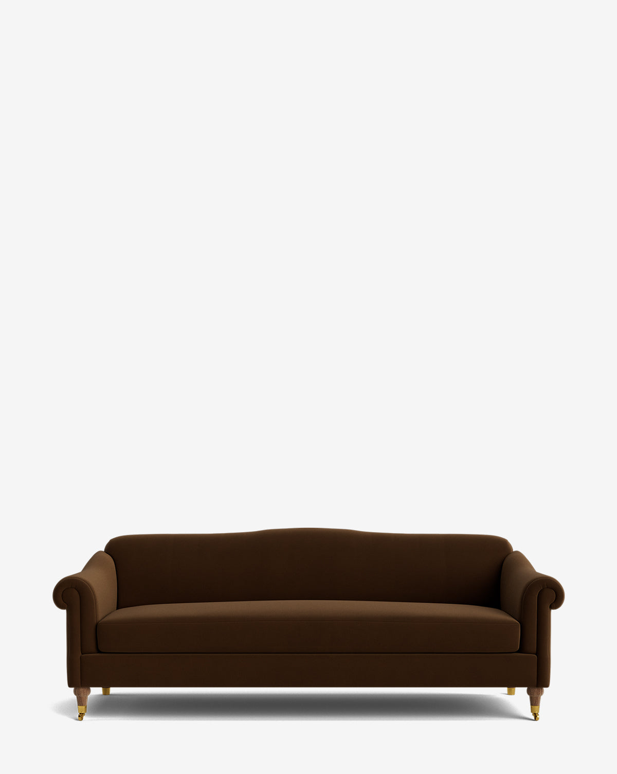 The Hildegard Sofa 90 is a dark brown upholstered, handcrafted sofa with curved arms and backrest, gold-capped front legs, and wooden rear legs, displayed against a plain white background by McGee & Co.