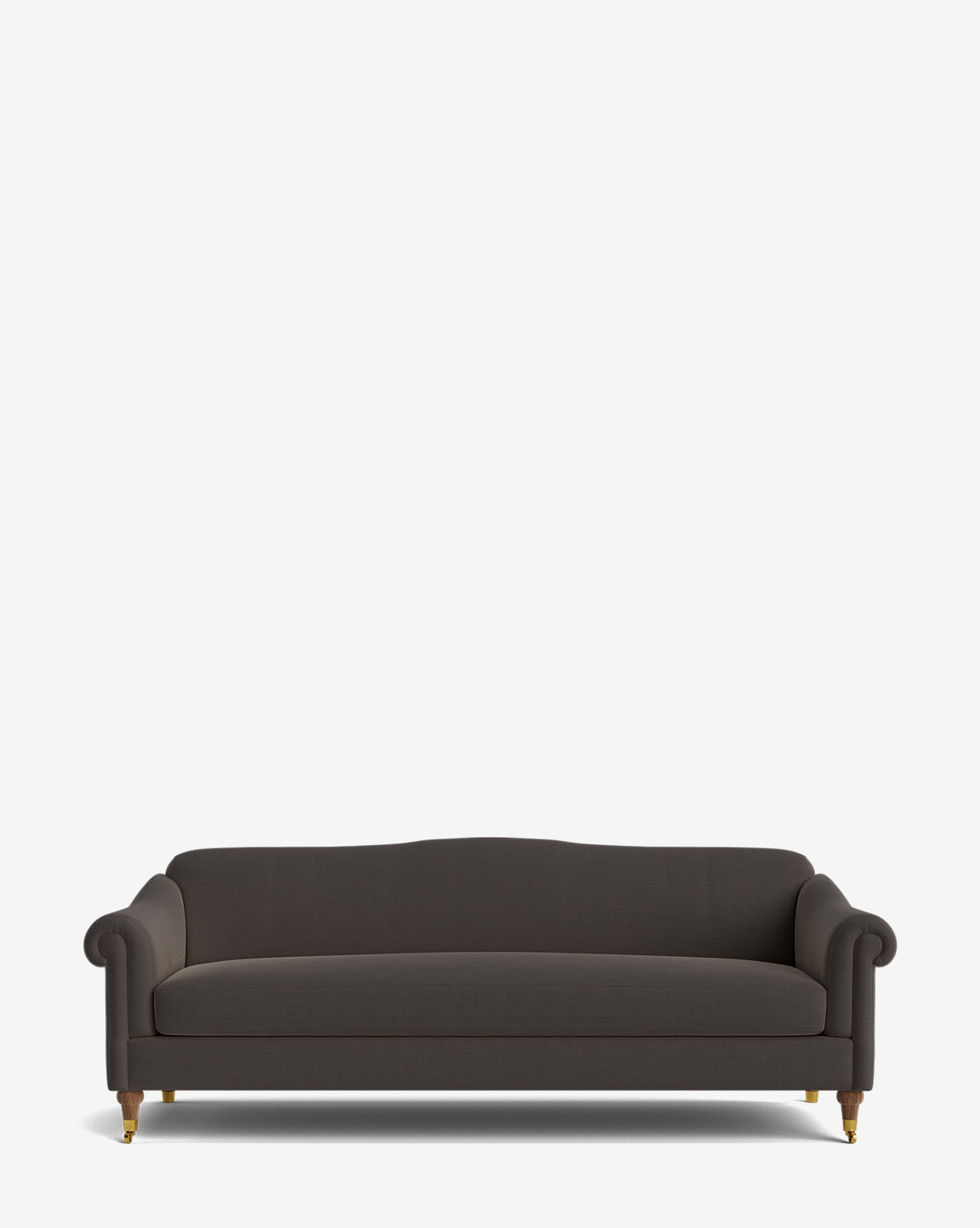 The Hildegard Sofa 90 is a dark gray, three-seater sofa with rolled arms, a curved backrest, and wooden legs with brass casters, shown against a plain white background by McGee & Co.